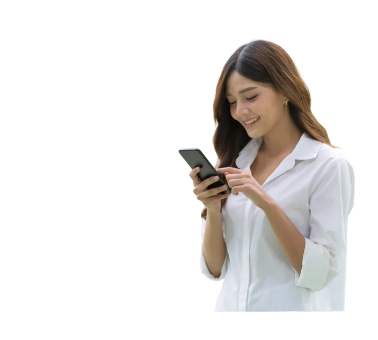 A woman smiling at her phone while chatting with Vera